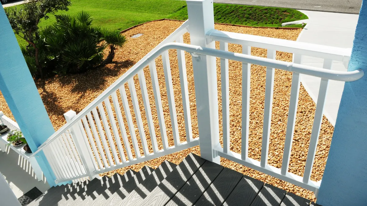 ADA compliant aluminum stairway handrails at a multi-unit property by AlliedFenceAndGate.com™
