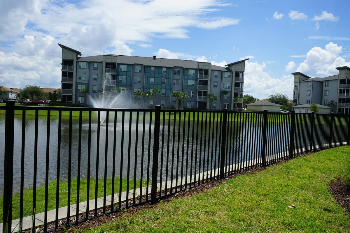 Apartment complex with professional perimeter aluminum fencing