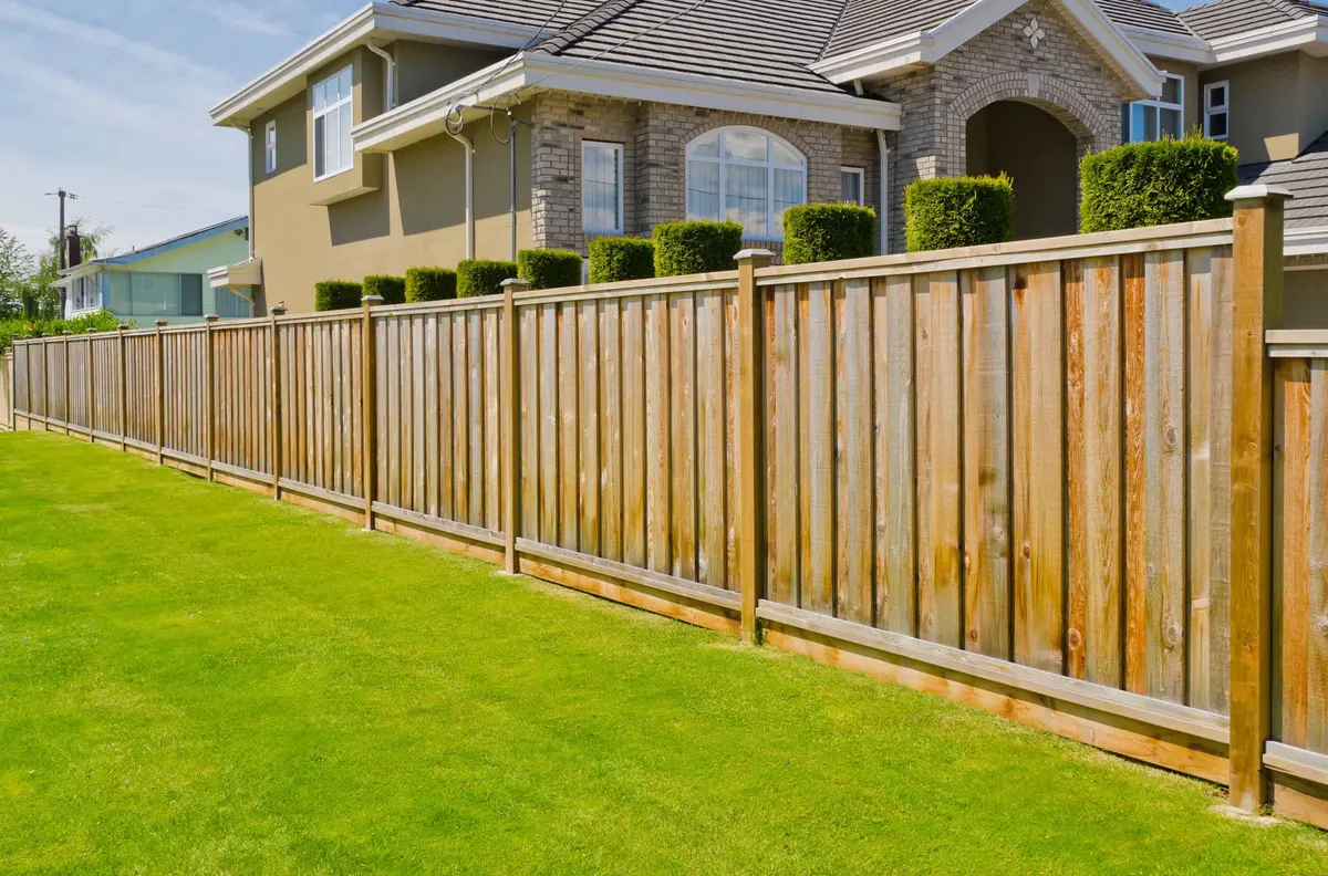 Storm damaged fence requiring emergency repair and insurance claim processing